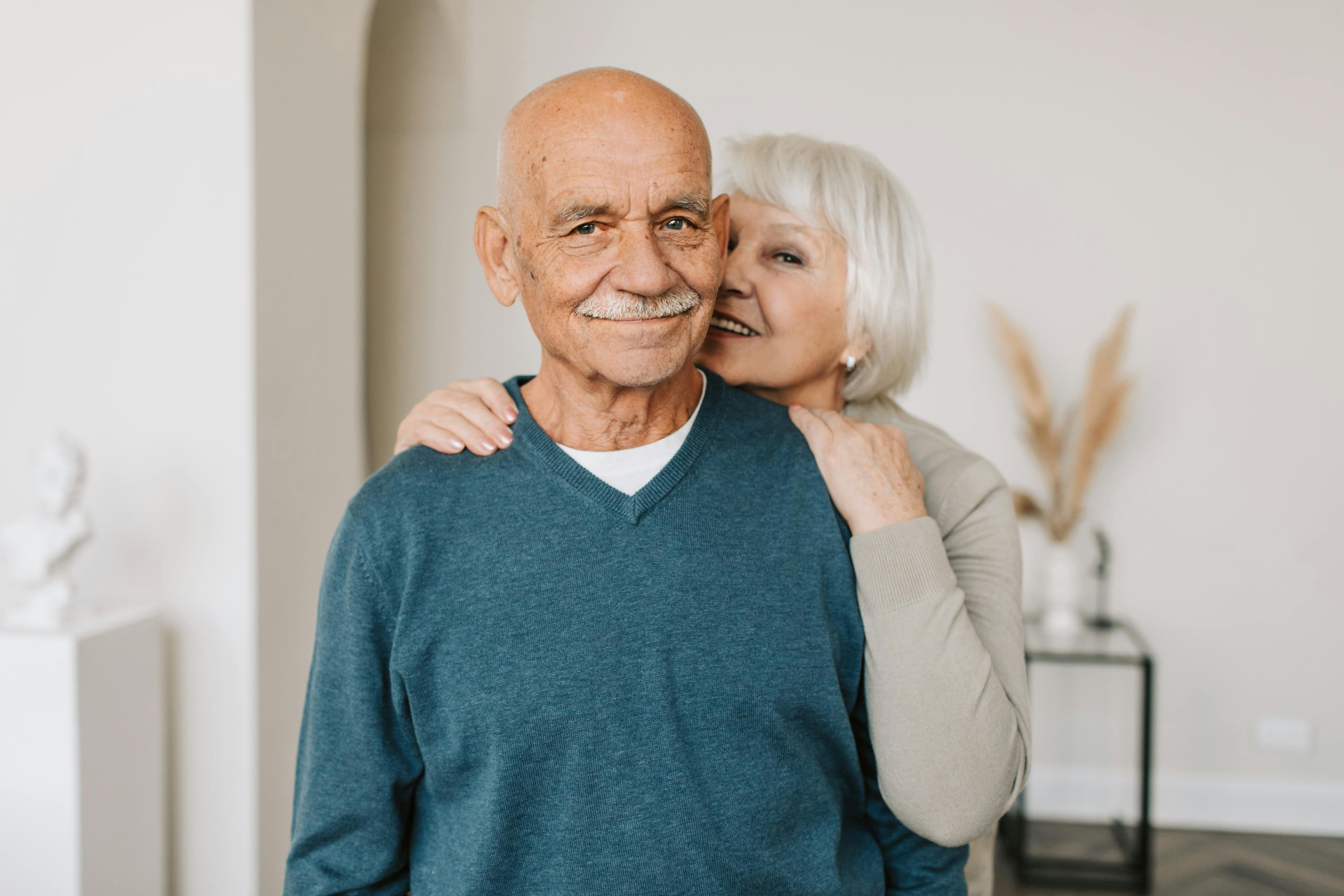Caregiver embracing a smiling client
